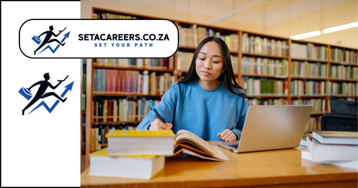South African university student studying with books and laptop on campus