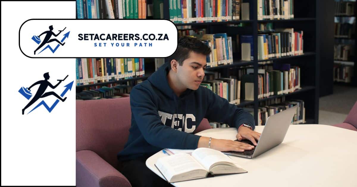 South African engineering student studying with books and laptop