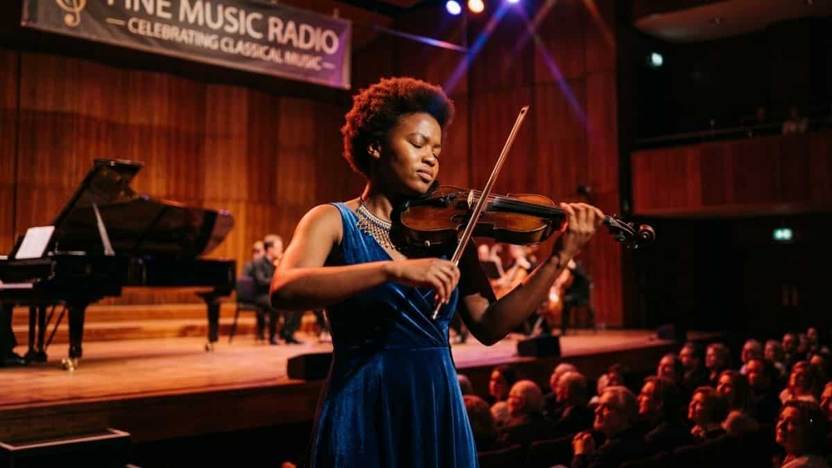 Music student performing live on stage during bursary audition