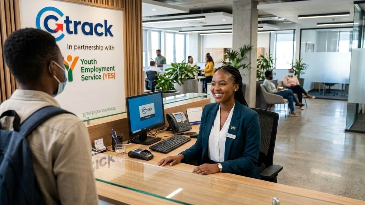 Young receptionist welcoming visitors in a modern office environment