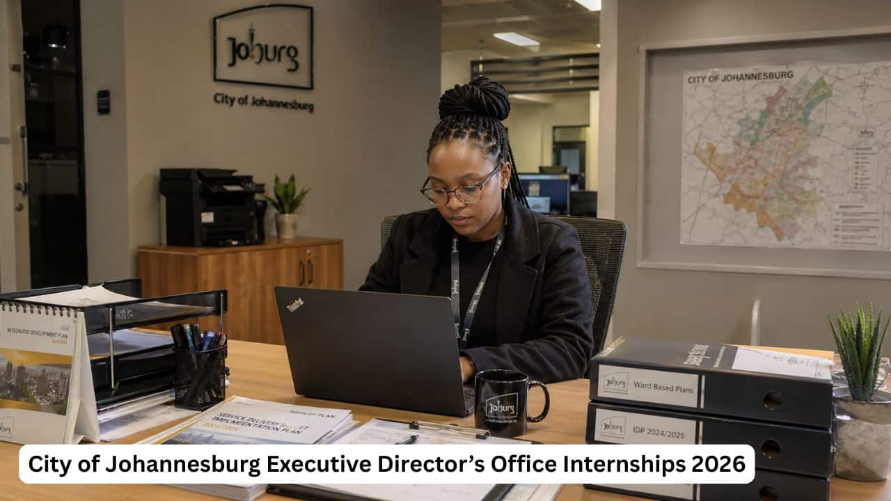 Young South African graduate intern reviewing municipal administration documents during a City of Johannesburg internship.