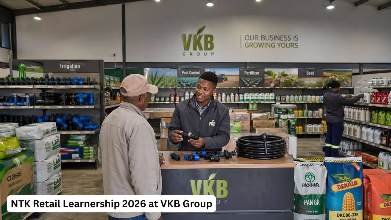 Young South African retail trainee helping a customer in an agricultural supply store during the NTK Retail Learnership at VKB Group