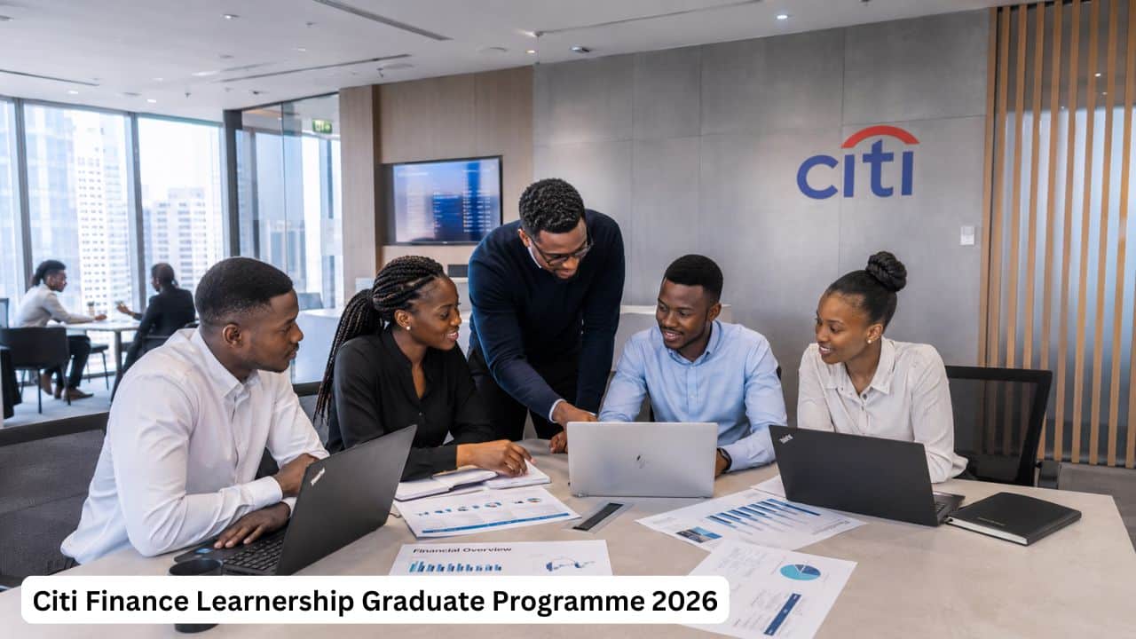 Young South African finance graduates reviewing reports during the Citi Finance Learnership Graduate Programme