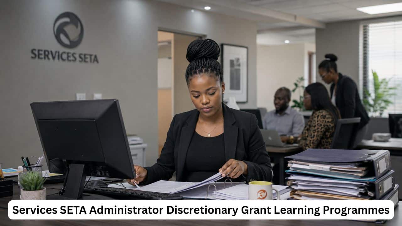 South African administrator reviewing learning programme documents in a professional SETA office.